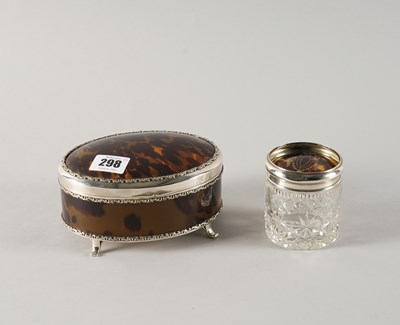 Lot 298 - A SILVER AND TORTOISESHELL OVAL BOX AND A GLASS TOILET JAR (2)