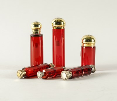 Lot 304 - THREE SILVER GILT MOUNTED VICTORIAN CRANBERRY COLOURED GLASS TOILET BOTTLES AND THREE FURTHER ITEMS (6)