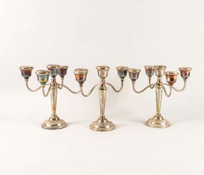 Lot 377 - A GARNITURE OF THREE SILVER TABLE CANDELABRA (3)