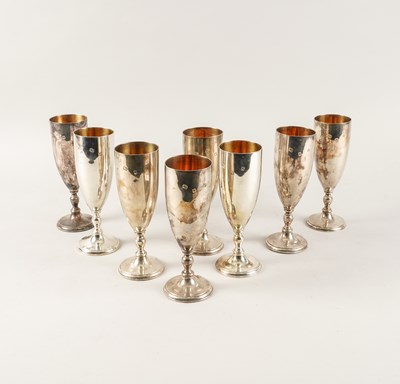 Lot 389 - A SET OF EIGHT SILVER WINE GOBLETS (8)