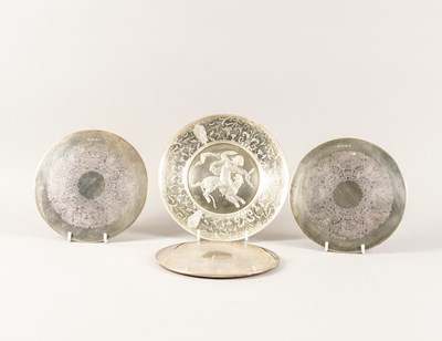Lot 399 - A SILVER AND AND GLASS DISH AND THREE SILVER MOUNTED GLASS TABLE MATS (4)