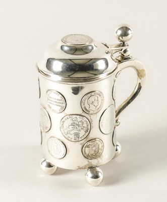 Lot 412 - A GERMAN HINGE LIDDED TANKARD