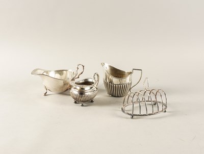 Lot 445 - A SILVER SAUCEBOAT AND THREE FURTHER ITEMS (4)