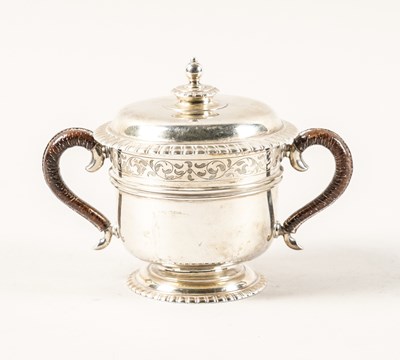 Lot 486 - A SILVER TWIN HANDLED PORRINGER WITH COVER