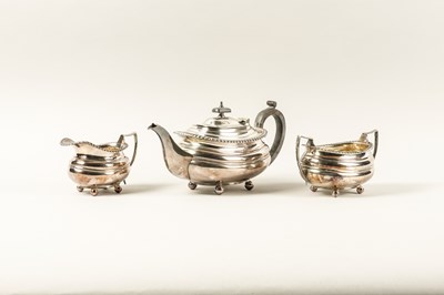 Lot 494 - A PLATED THREE PIECE TEA SET (3)