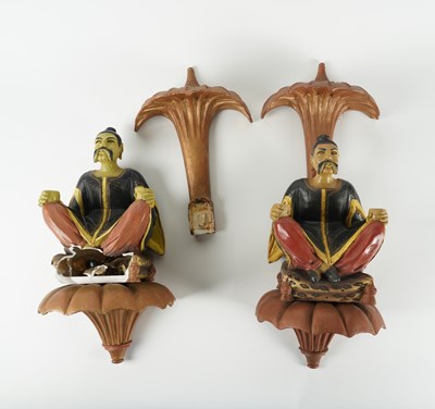 Lot 518 - A PAIR OF CHINESE POLYCHROME DECORATED FIGURATIVE WALL MOUNTS (2)
