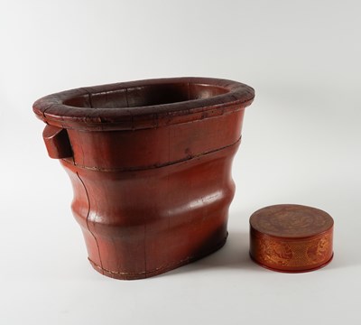 Lot 522 - A CHINESE RED LACQUER BABY BATH (2)