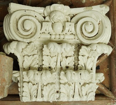 Lot 548 - A GROUP OF MOULDED PLASTER ARCHITECTURAL PLAQUES AND ELEMENTS, TOGETHER WITH PAINTED WOOD CORINTHIAN CAPITALS (QTY)
