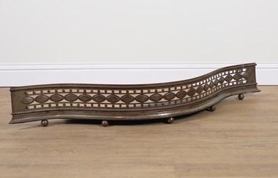 Lot 553 - A GEORGE III STYLE STEEL SERPENTINE FENDER