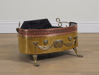 Lot 555 - A BRASS AND COPPER MOUNTED BRAZIER