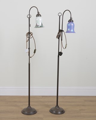 Lot 567 - TWO SIMILAR PATINATED METAL AJUSTABLE FLOOR STANDING LIGHTS (2)