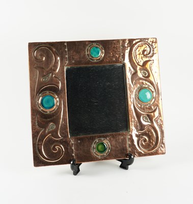 Lot 580 - AN ART NOUVEAU COPPER AND ENAMEL MIRROR IN THE MANNER OF LIBERTY