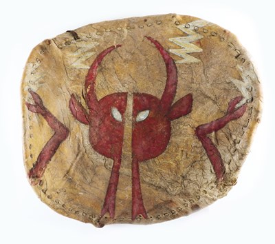 Lot 597 - A NATIVE AMERICAN PLAINS INDIANS PAINTED HIDE WARRIOR SHIELD AND ANTELOPE FOOT AMULET (2)