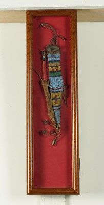 Lot 598 - A NATIVE AMERICAN PLAINS INDIANS GLASS SEED BEAD AND LEATHER KNIFE SHEATH