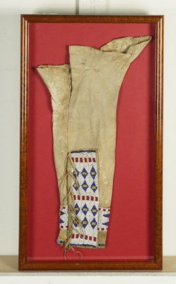 Lot 599 - A NATIVE AMERICAN CHEYENNE GLASS SEED BEADWORK AND HIDE CHILD'S LEGGING TOGETHER WITH OTHER ITEMS (4)