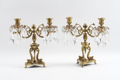 Lot 612 - A PAIR OF REGENCY GILT-BRASS TWIN LIGHT CANDELABRA (2)
