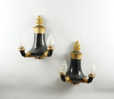 Lot 629 - A PAIR OF REGENCY STYLE BLACK AND GILT TWIN BRANCH TORCH STYLE WALL LIGHTS (2)