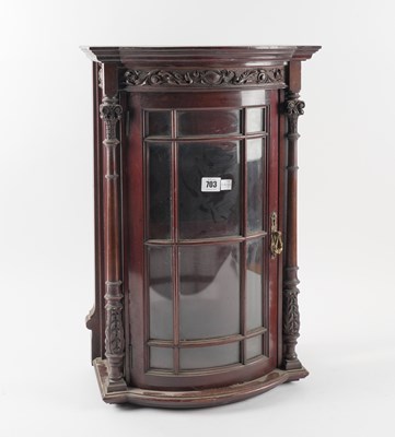 Lot 703 - A LATE 19TH CENTURY CARVED MAHOGANY BOWFRONT HANGING DISPLAY CABINET