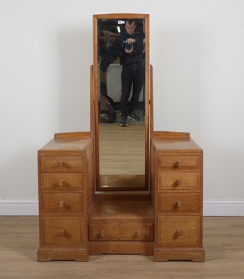 Lot 722 - COTSWOLDS SCHOOL DESIGN; A 20TH CENTURY OAK TWIN PEDESTAL DRESSING TABLE