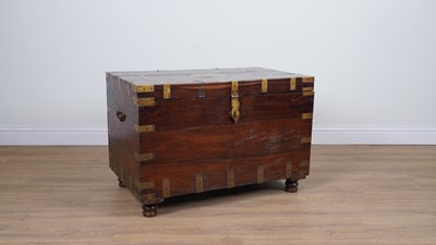Lot 736 - AN 19TH CENTURY ANGLO-INDIAN BRASS BOUND TEAK RECTANGULAR TRUNK