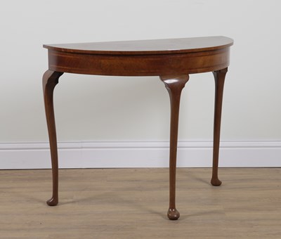 Lot 788 - A GEORGE III STYLE FEATHER BANDED RADIAL WALNUT VENEERED DEMI-LUME CONSOLE TABLE