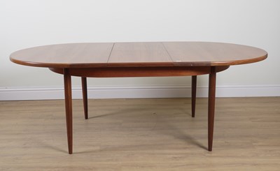 Lot 832 - G-PLAN; A TEAK OVAL EXTENDING DINING TABLE
