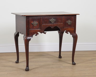 Lot 846 - A GEORGE II OAK THREE DRAWER LOWBOY