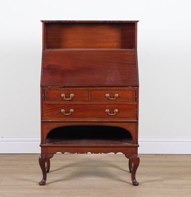 Lot 891 - IN THE MANNER OF LIBERTY’S; A MAHOGANY BUREAU WITH INTEGRAL SHELF BACK