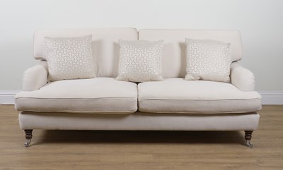 Lot 897 - A MODERN CREAM UPHOLSTERED THREE SEAT SOFA