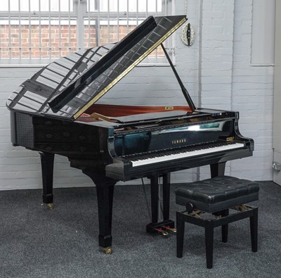 Lot 902 - YAMAHA; A HIGH GLOSS EBONISED C3 IRON FRAMED OVERSTRUNG BABY GRAND PIANO