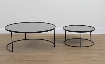 Lot 919 - NOTRE MONDE; A GRADUATED PAIR OF EBONISED CIRCULAR OCCASIONAL TABLES (2)