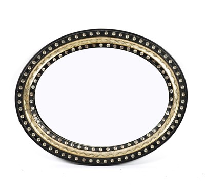 Lot 924 - A 19TH CENTURY IRISH EBONISED OVAL MIRROR