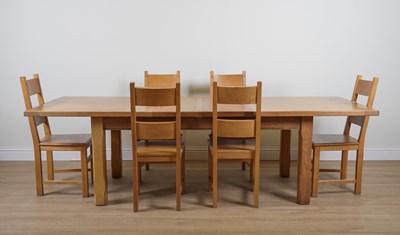 Lot 982 - A MODERN OAK EXTENDING DINNING TABLE (7)