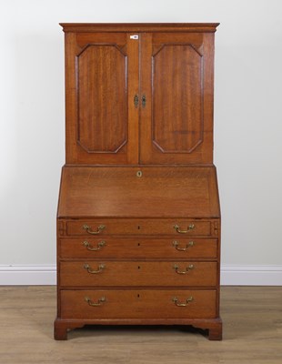 Lot 991 - A GEORGE III OAK BUREAU BOOKCASE