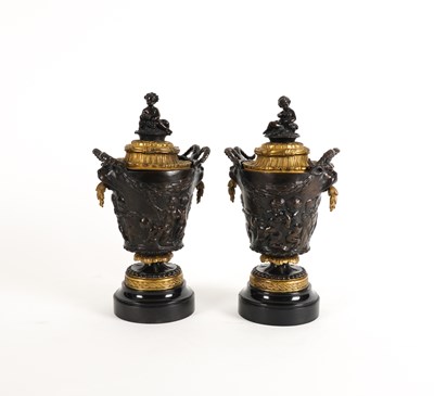 Lot 642 - A PAIR OF FRENCH GILT MOUNTED AND PATINATED BRONZE BACCHANALIAN URNS AND COVERS AFTER CLODION (2)
