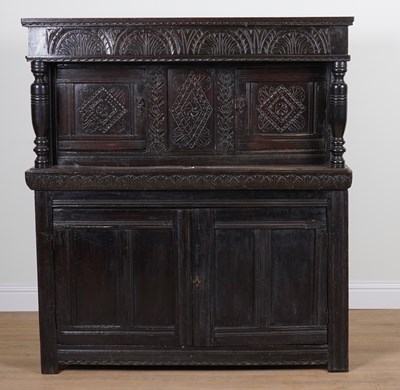 Lot 723 - A 17TH CENTURY AND LATER CARVED OAK COURT CUPBOARD