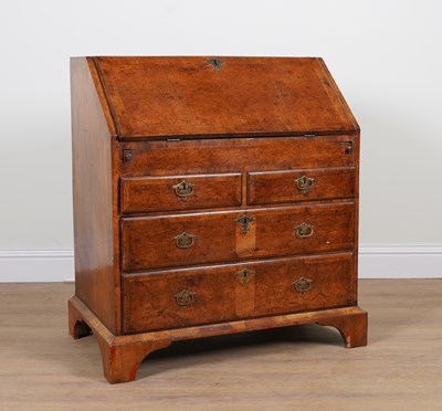 Lot 869 - A GEORGE II WALNUT FOUR DRAWER BUREAU