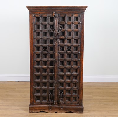Lot 893 - A MODERN STUDDED IRON HARDWOOD CUPBOARD