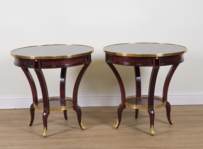 Lot 890 - TALLIARDAT; A PAIR OF GILT METAL MOUNTED CIRCULAR MAHOGANY GUERIDONS (2)