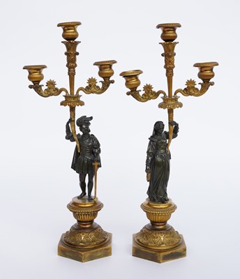 Lot 589 - A PAIR OF FRENCH LOUIS-PHILIPPE GILT AND PATINATED BRONZE THREE-LIGHT FIGURAL CANDELABRA (2)