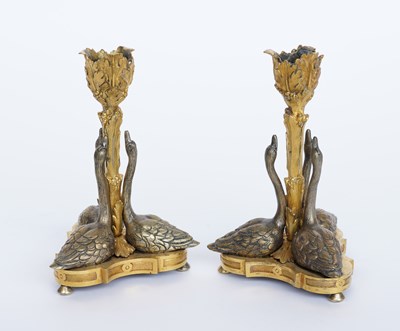 Lot 601 - A PAIR OF GILT-BRONZE SWAN CANDLESTICKS (2)