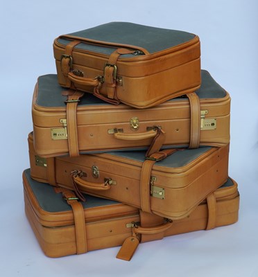 Lot 661 - A SET OF FOUR GRADUATED SWAINE ADELEY LEATHER AND CANVAS SUITCASES (4)
