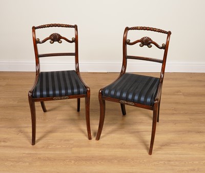 Lot 1066 - A PAIR OF REGENCY GILT-METAL MOUNTED FAUX ROSEWOOD SIDE CHAIRS (2)