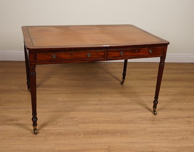 Lot 1100 - A REGENCY EBONY STRUNG MAHOGANY TWO DRAWER WRITING TABLE