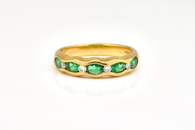 Lot 1802 - AN 18CT GOLD, EMERALD AND DIAMOND HALF HOOP RING