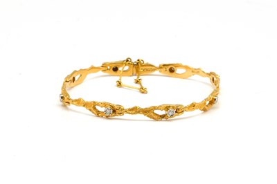 Lot 1805 - A GOLD AND DIAMOND BRACELET