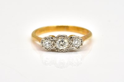 Lot 1812 - AN 18CT GOLD AND DIAMOND THREE STONE RING