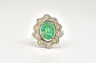 Lot 1830 - A RUSSIAN WHITE GOLD, EMERALD AND DIAMOND CLUSTER RING