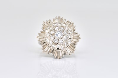 Lot 1850 - A WHITE GOLD AND DIAMOND CLUSTER RING