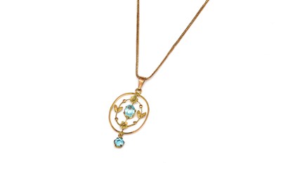Lot 1856 - A GOLD AND PALE BLUE GEM SET PENDANT WITH A 9CT GOLD NECKCHAIN (2)